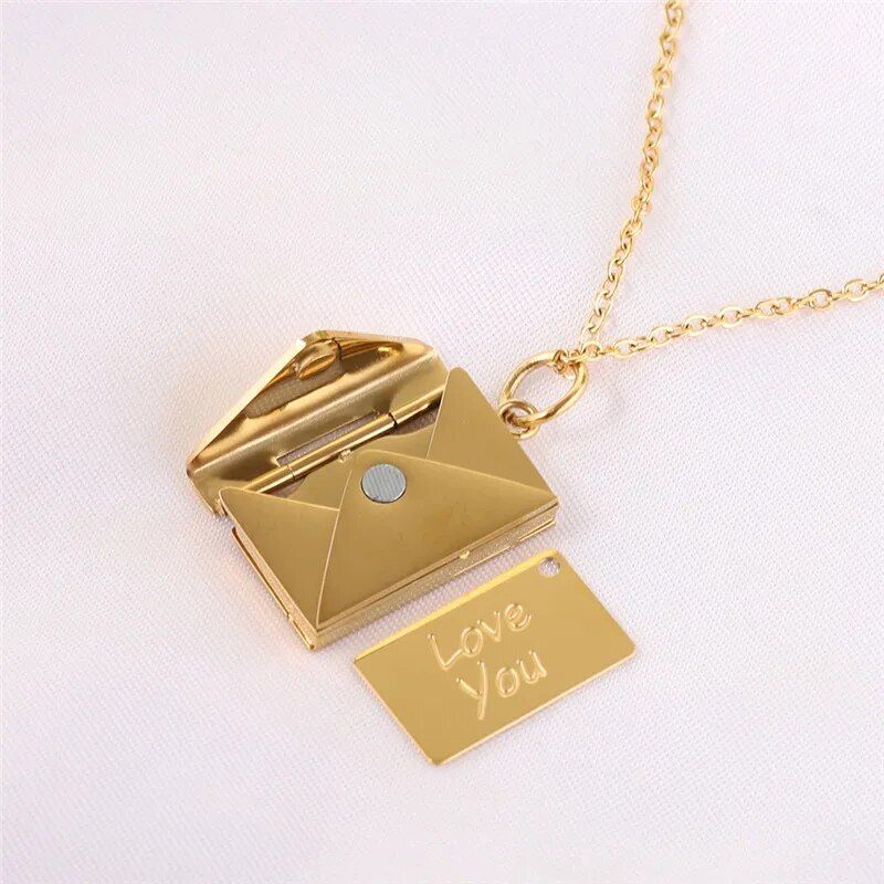 Love Letter Envelope Pendant Necklace shaped like a miniature envelope with a chain, featuring a pull-out card inscribed with "love you," now considered a must-have fashion accessory.