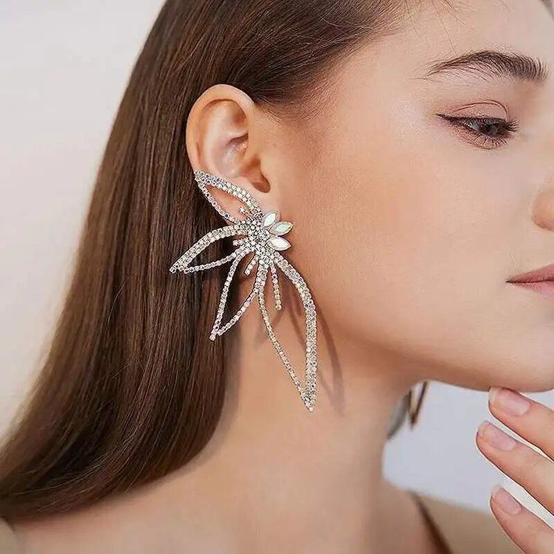 Close-up of a woman wearing Chic Maple Leaf Zircon Earrings, embodying new fashion style.
