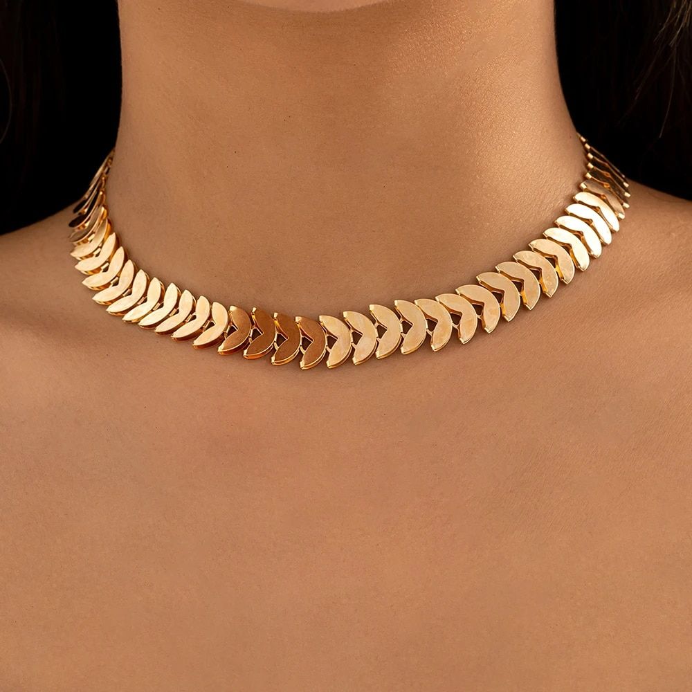 Gold Petal Choker Necklace for Women on a woman’s neck, showcased against a neutral background, representing new fashion trends.