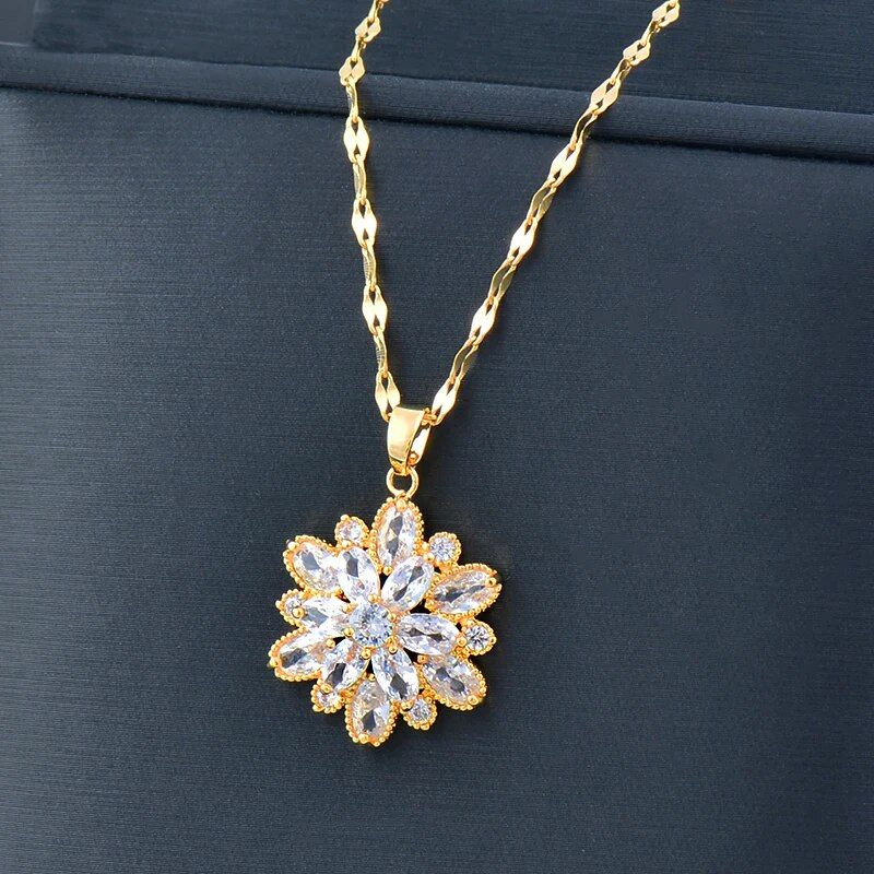 Womens Gold-Plated Crystal Flower Pendant Choker necklace adorned with diamonds and set against a dark background, embodying new fashion style.