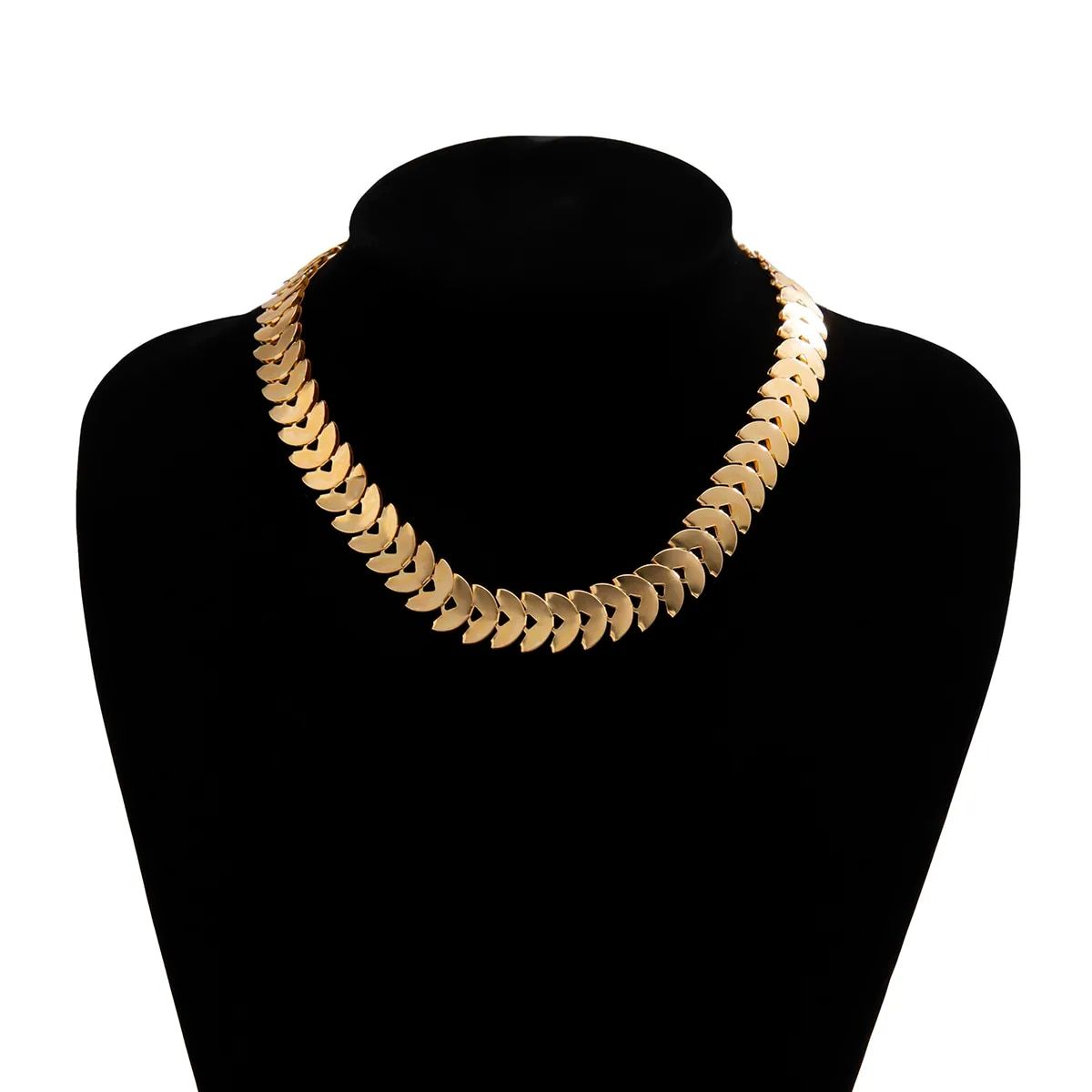 Gold Petal Choker Necklace for Women with leaf-shaped links displayed on a black mannequin bust against a white background, epitomizing the latest fashion trends.