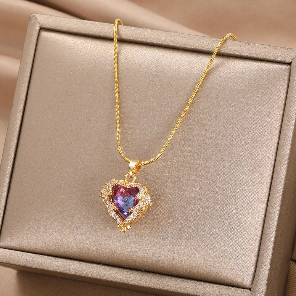 Gold-plated enamel red heart pendant necklace with a pink gemstone, displayed in an open beige jewelry box—a perfect fashion accessory for women's fashion.